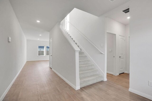 hallway featuring light wood-type flooring