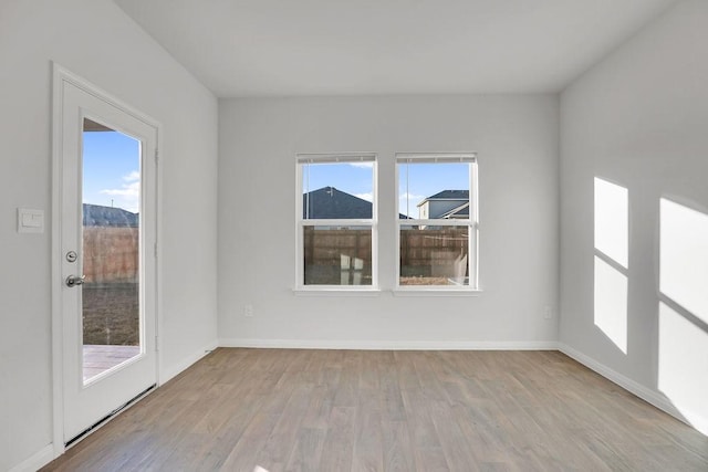 spare room with light hardwood / wood-style flooring