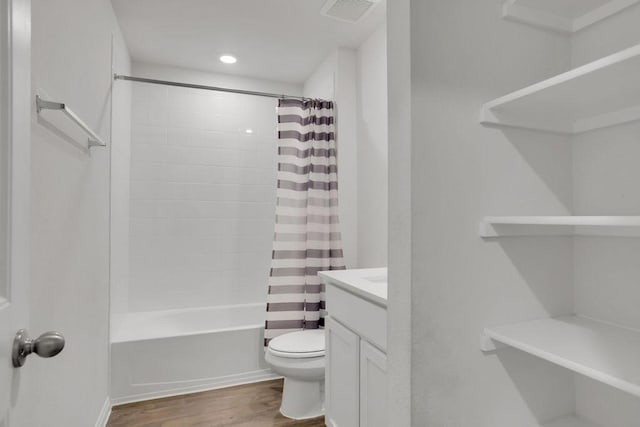 full bathroom with vanity, toilet, shower / tub combo, and wood-type flooring