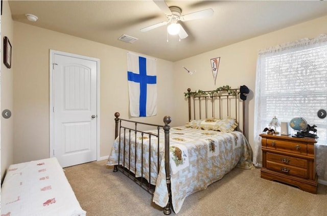 carpeted bedroom featuring ceiling fan