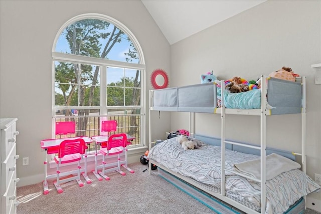 carpeted bedroom with vaulted ceiling