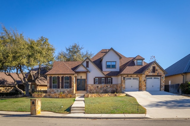 view of front facade featuring a garage and a front yard