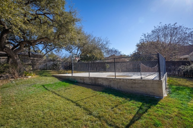 view of yard featuring basketball court