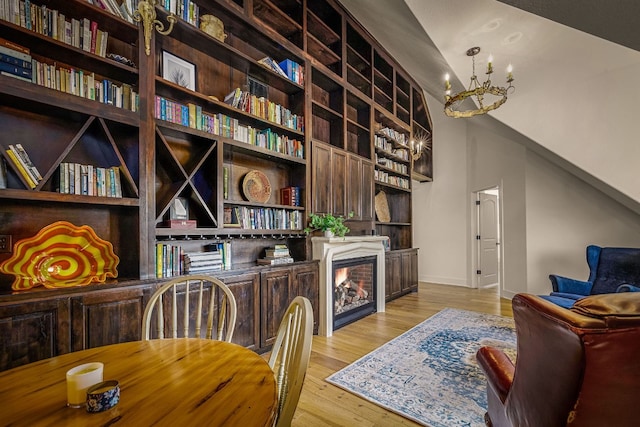 office with a chandelier and light hardwood / wood-style flooring