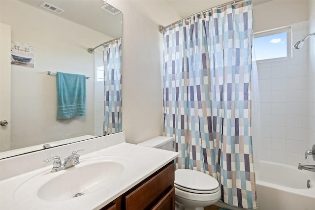 full bathroom featuring toilet, vanity, and shower / bathtub combination with curtain