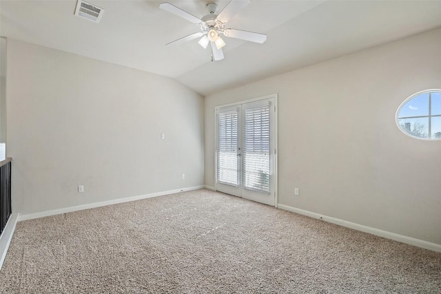 unfurnished room with ceiling fan, lofted ceiling, and carpet flooring