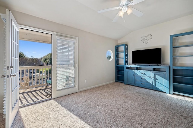 living room featuring lofted ceiling, light colored carpet, and ceiling fan