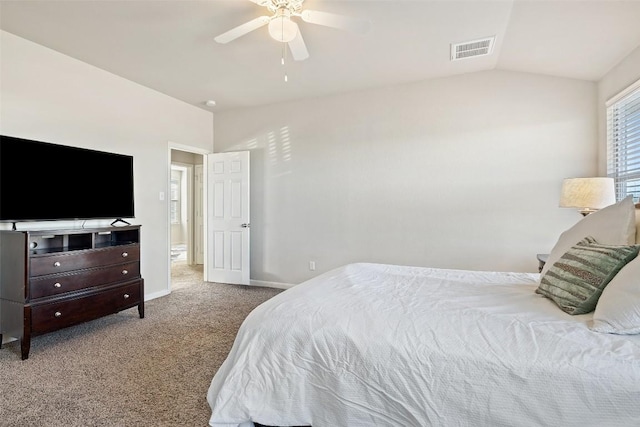 bedroom with lofted ceiling, light colored carpet, and ceiling fan