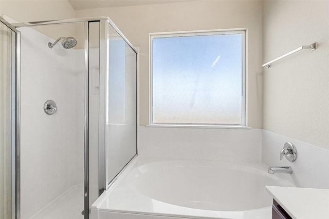 bathroom featuring vanity and plus walk in shower