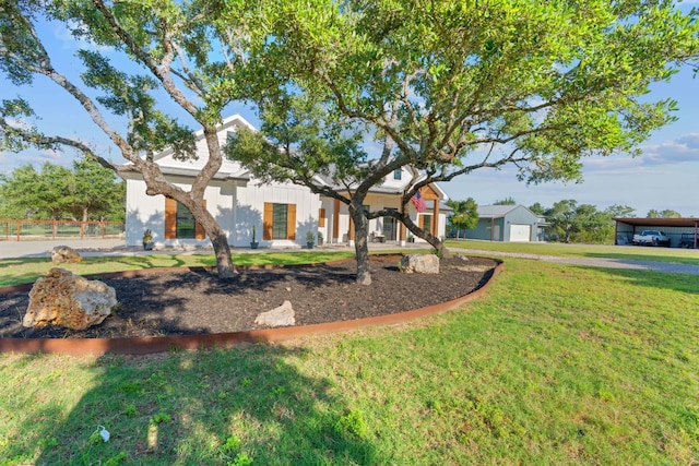 view of front of property with a garage and a front yard