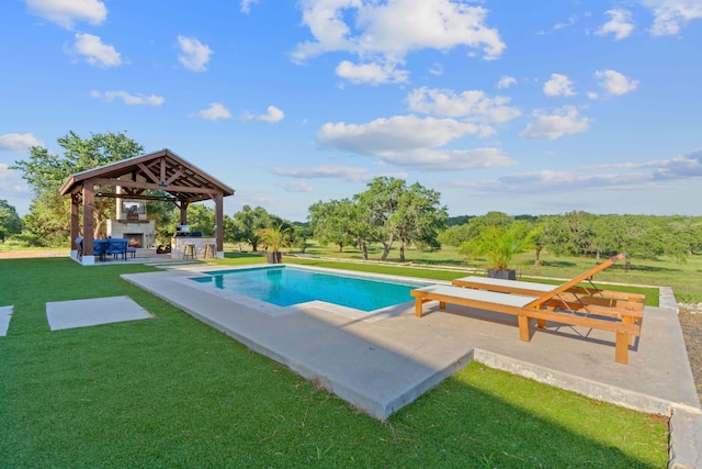 view of pool with an outdoor fireplace, a gazebo, exterior bar, and a lawn