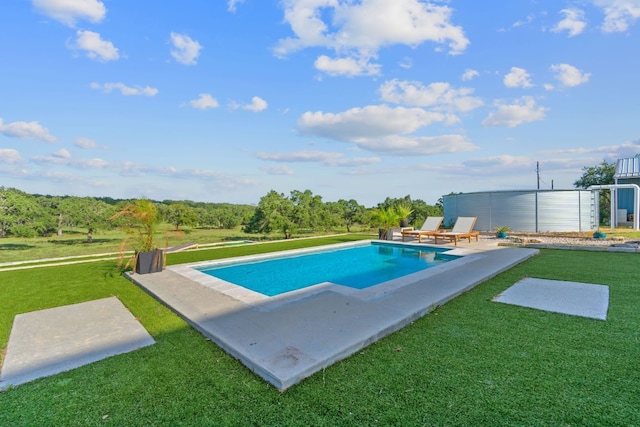 view of pool featuring a patio and a lawn