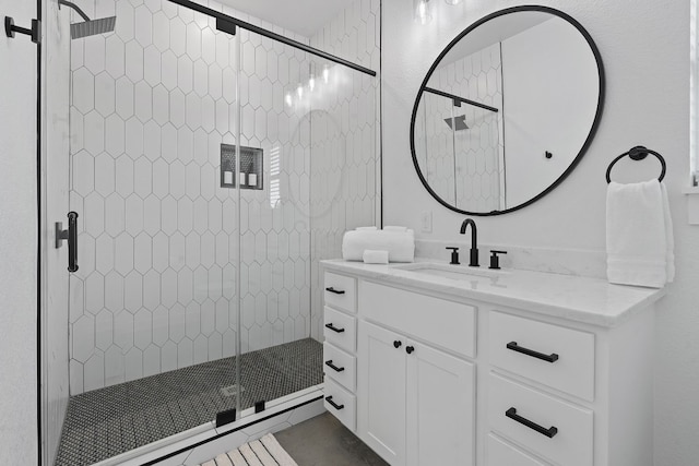 bathroom with vanity and walk in shower