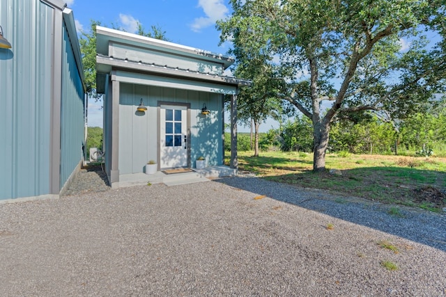 view of outbuilding with a yard