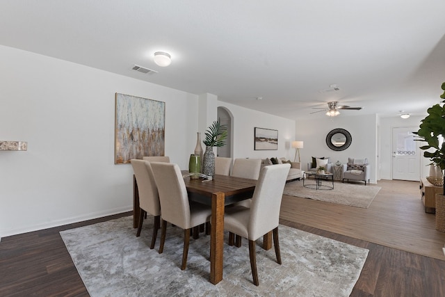 dining area featuring ceiling fan and dark hardwood / wood-style floors