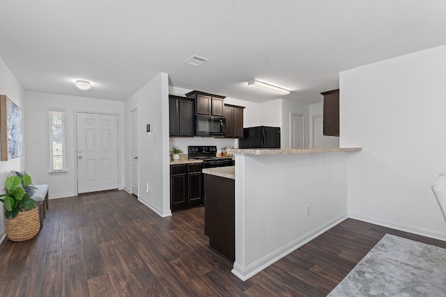 kitchen with dark hardwood / wood-style floors, kitchen peninsula, dark brown cabinets, and black appliances