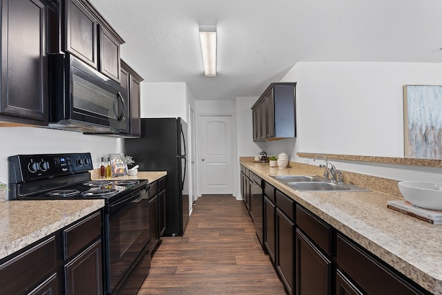 kitchen with dark wood-type flooring, sink, dark brown cabinets, a textured ceiling, and black appliances