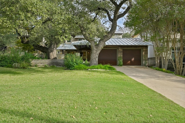 view of front facade featuring a garage and a front lawn