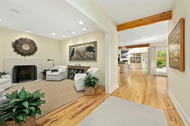 living room featuring hardwood / wood-style flooring and beamed ceiling