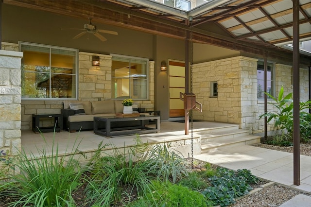 view of patio with an outdoor living space and ceiling fan