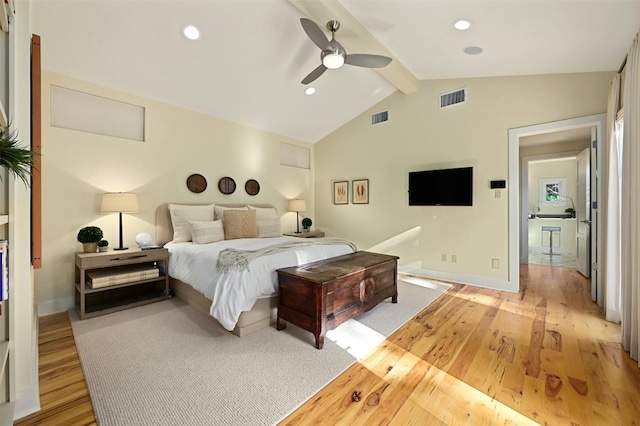 bedroom featuring lofted ceiling with beams, ceiling fan, and light wood-type flooring