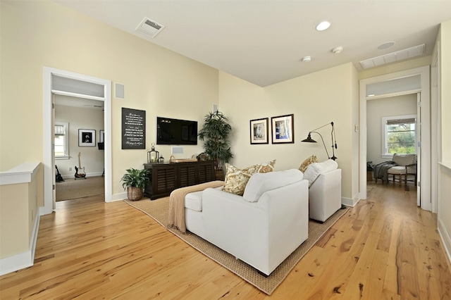 living room with light hardwood / wood-style floors