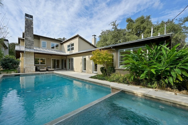 rear view of house with a patio