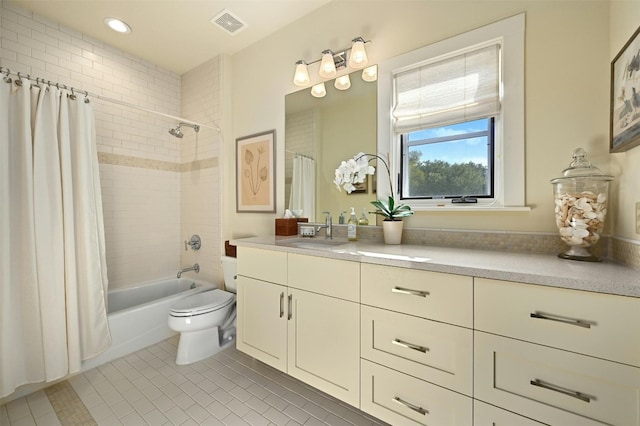 full bathroom featuring vanity, tile patterned flooring, shower / bath combination with curtain, and toilet