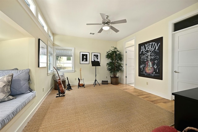 sitting room featuring ceiling fan and light hardwood / wood-style floors