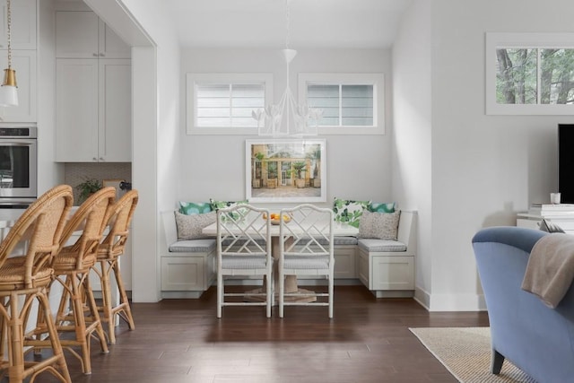 dining space with dark hardwood / wood-style flooring and breakfast area