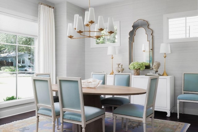 1911 W 36th St, Austin, TX 78731 - dining room with a chandelier, wood finished floors, and wallpapered walls