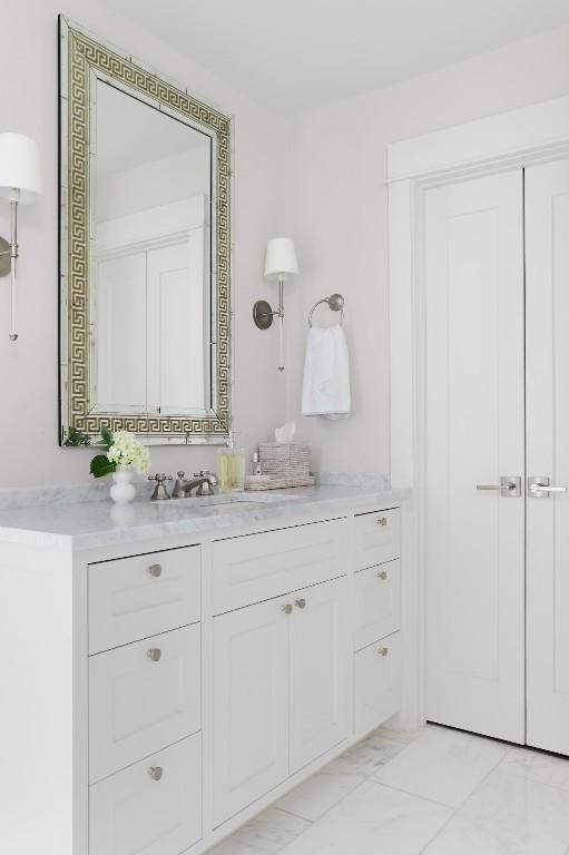 1911 W 36th St, Austin, TX 78731 - bathroom featuring vanity and marble look tile flooring