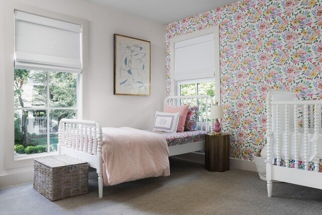 bedroom with multiple windows and carpet flooring