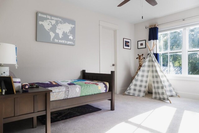 bedroom featuring ceiling fan and carpet floors