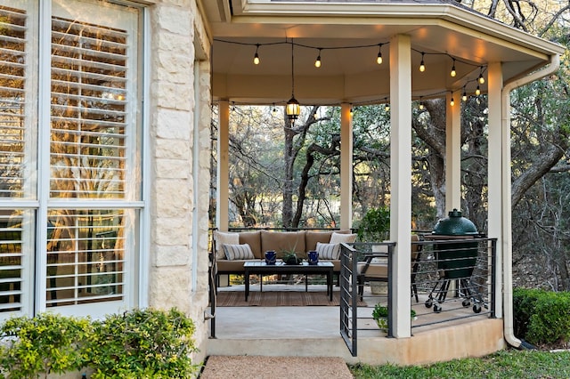 view of patio featuring a gazebo and an outdoor living space