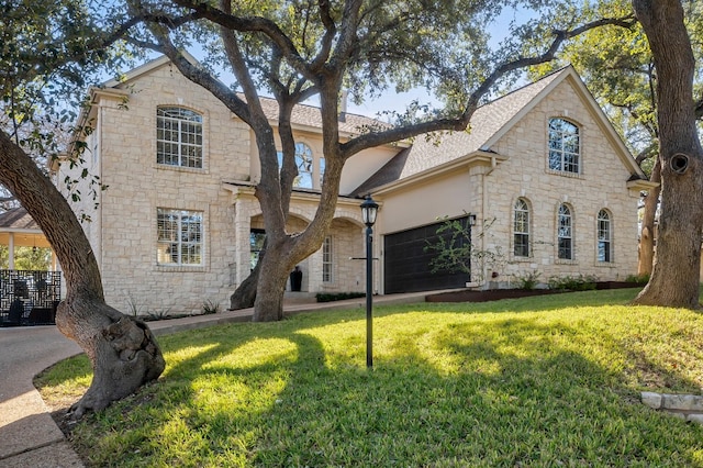 view of front facade with a garage and a front yard