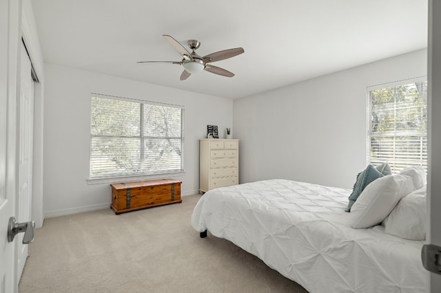 carpeted bedroom featuring ceiling fan