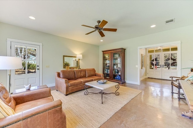 living room featuring plenty of natural light, ceiling fan, and french doors