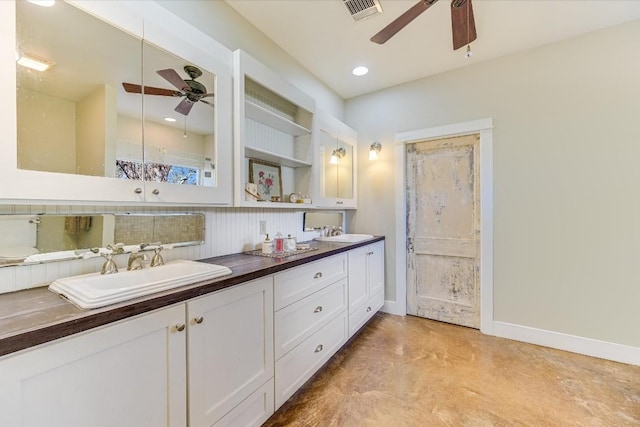 bathroom featuring ceiling fan, vanity, and concrete floors