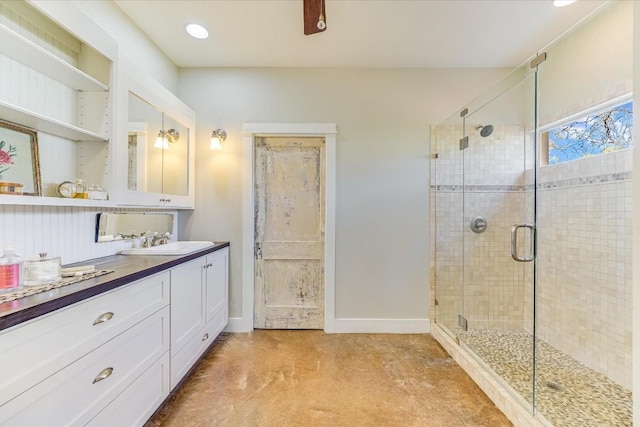 bathroom featuring an enclosed shower and vanity