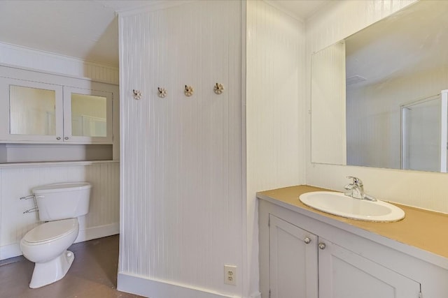 bathroom featuring vanity and toilet