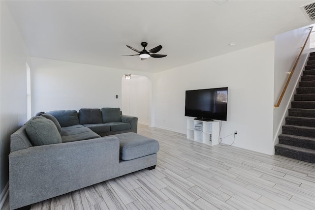 living room with ceiling fan and light hardwood / wood-style floors