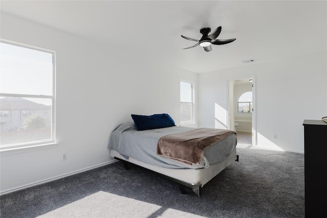 carpeted bedroom with connected bathroom and ceiling fan