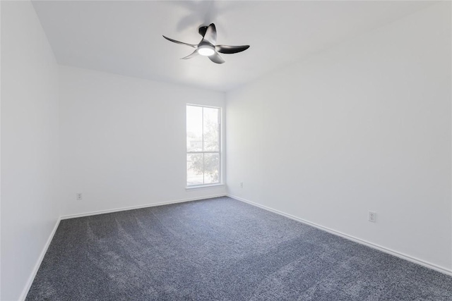 unfurnished room featuring ceiling fan and carpet