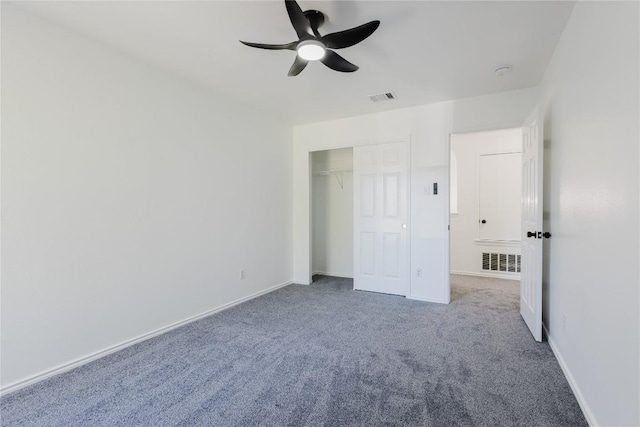 unfurnished bedroom featuring ceiling fan, carpet floors, and a closet