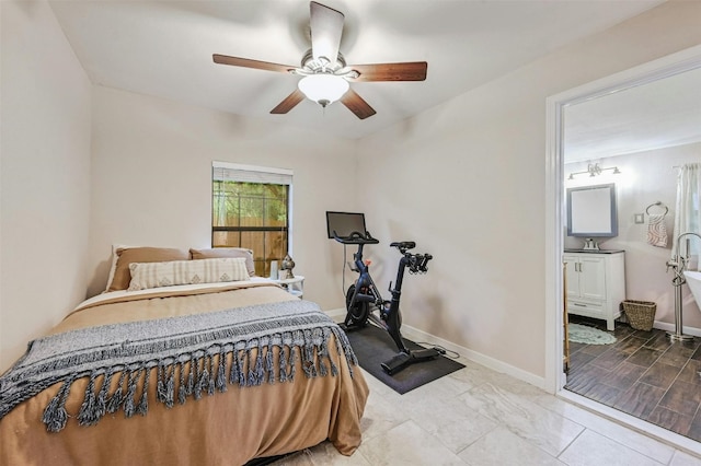 bedroom featuring ceiling fan and connected bathroom