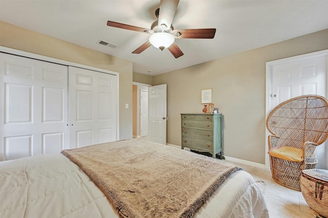 bedroom with ceiling fan and a closet