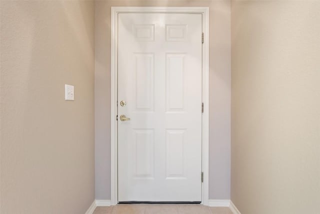 entryway featuring light tile patterned floors