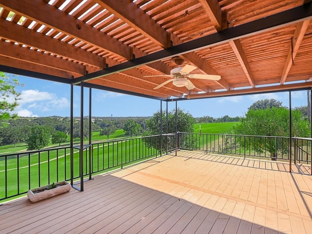 wooden deck featuring a yard, a pergola, and ceiling fan