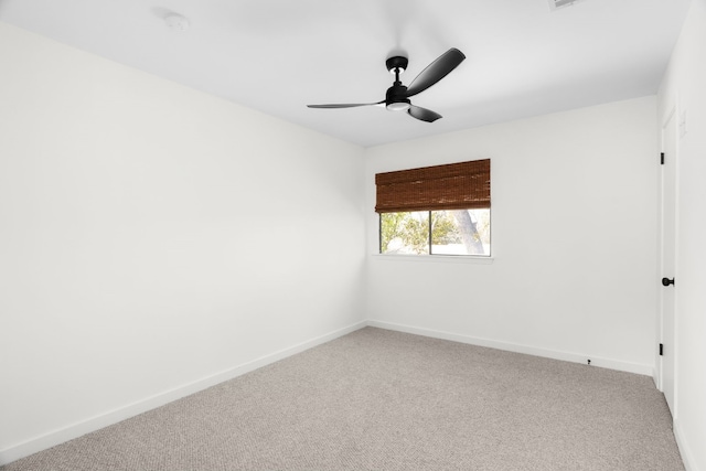 spare room with carpet and ceiling fan